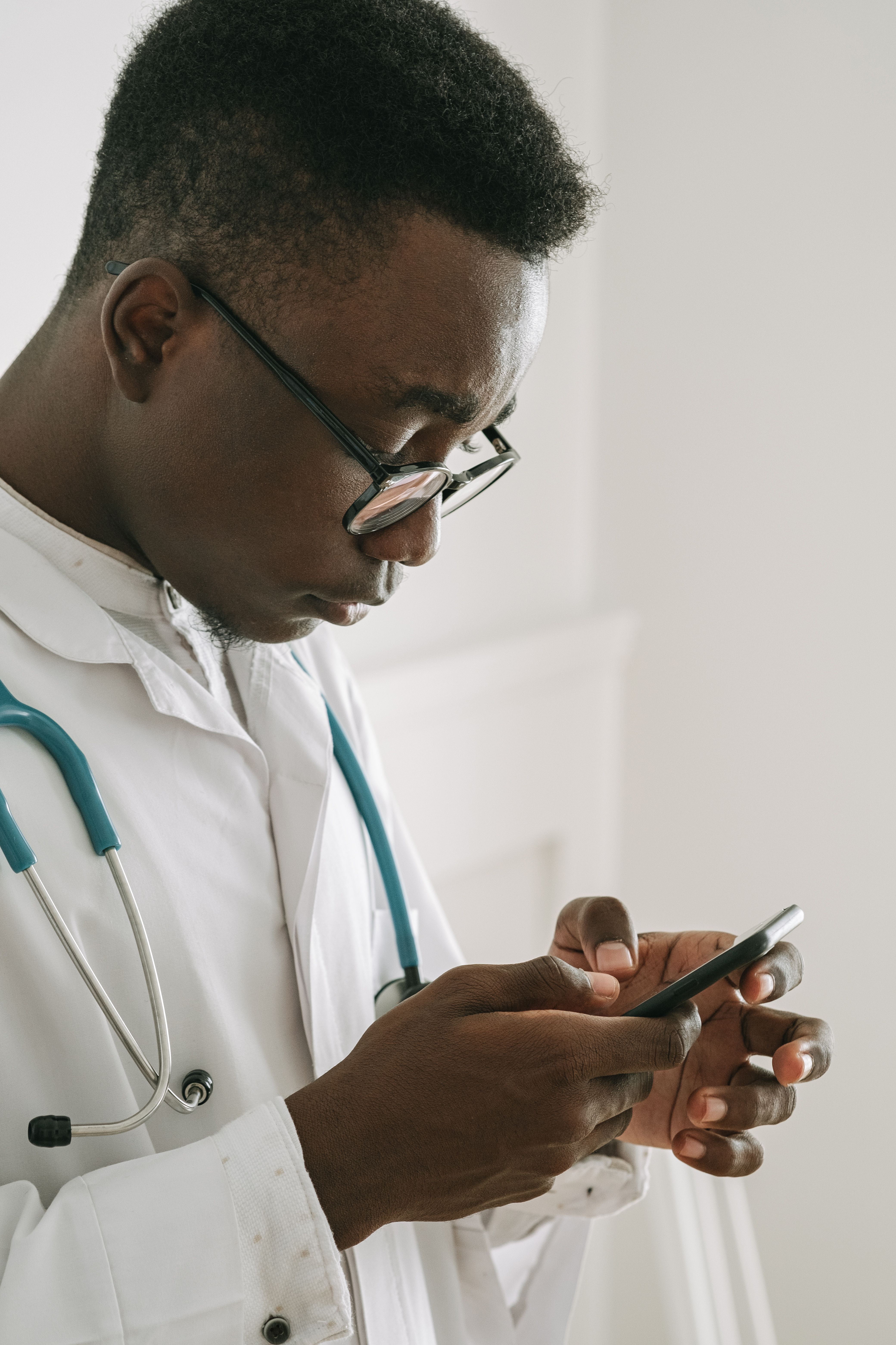 A doctor using a mobile phone